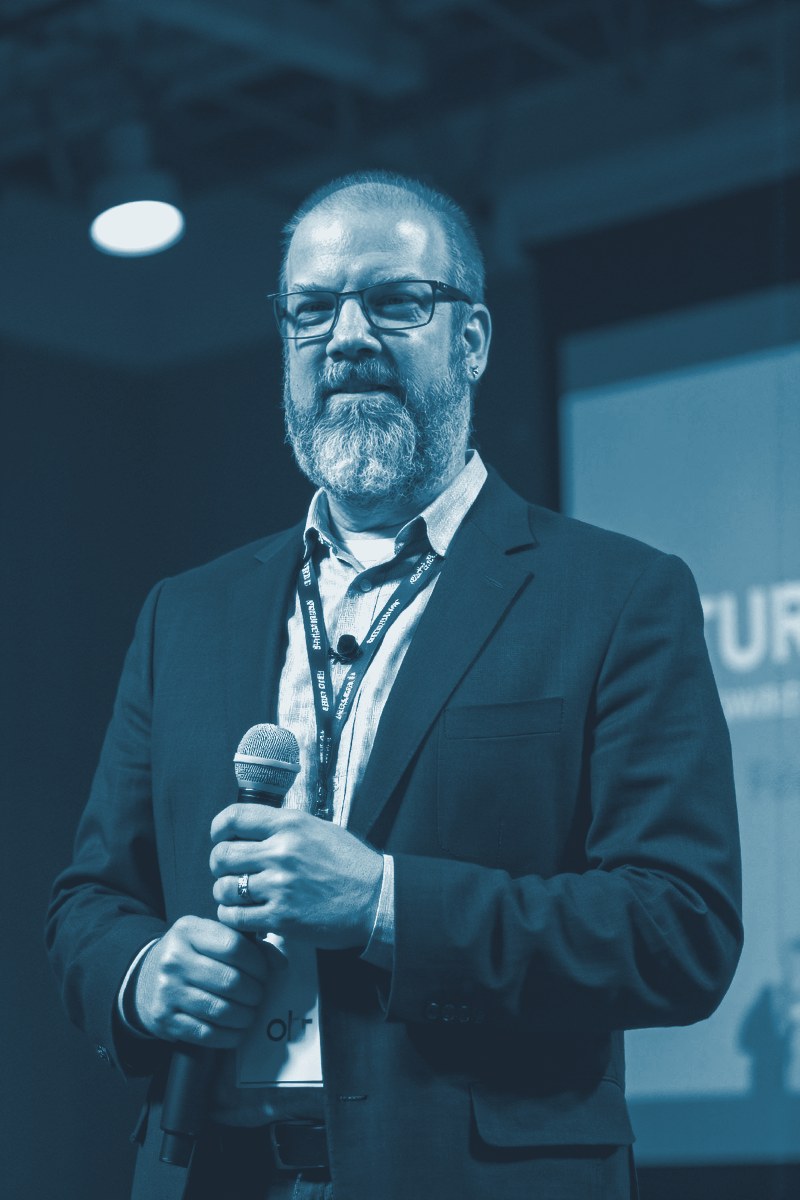 Will Simpson speaking on stage
